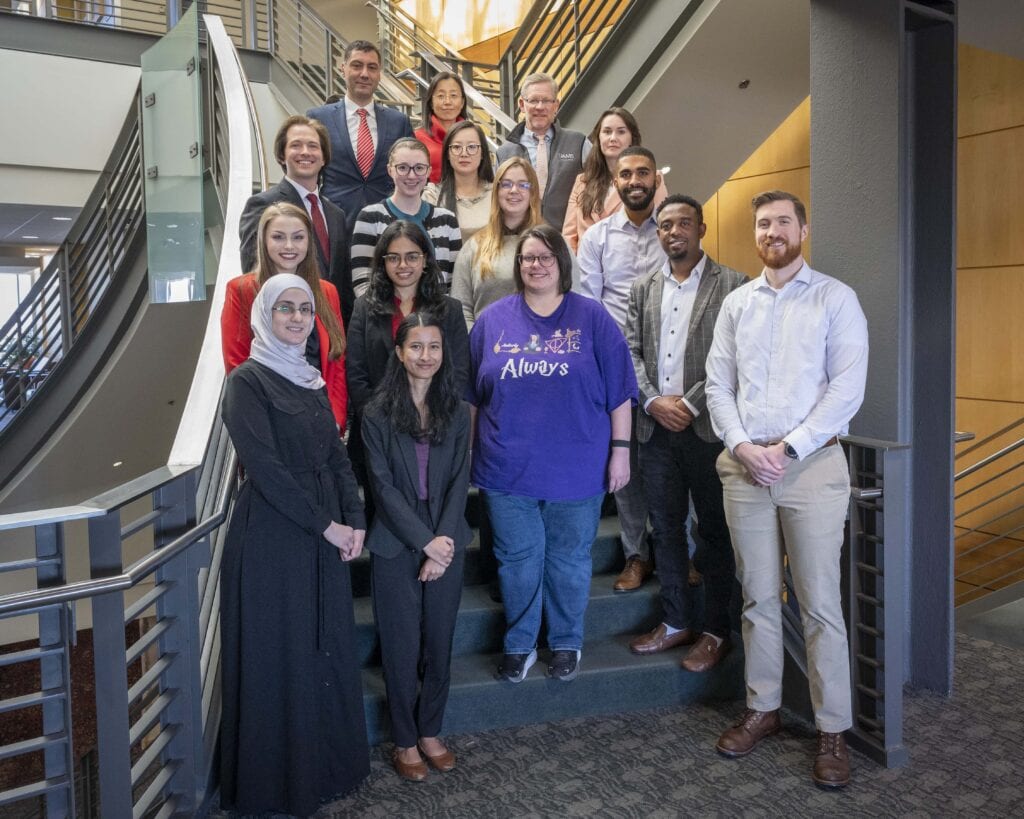 Group of pharmacy pharmacy evaluation program students standing in a stairway